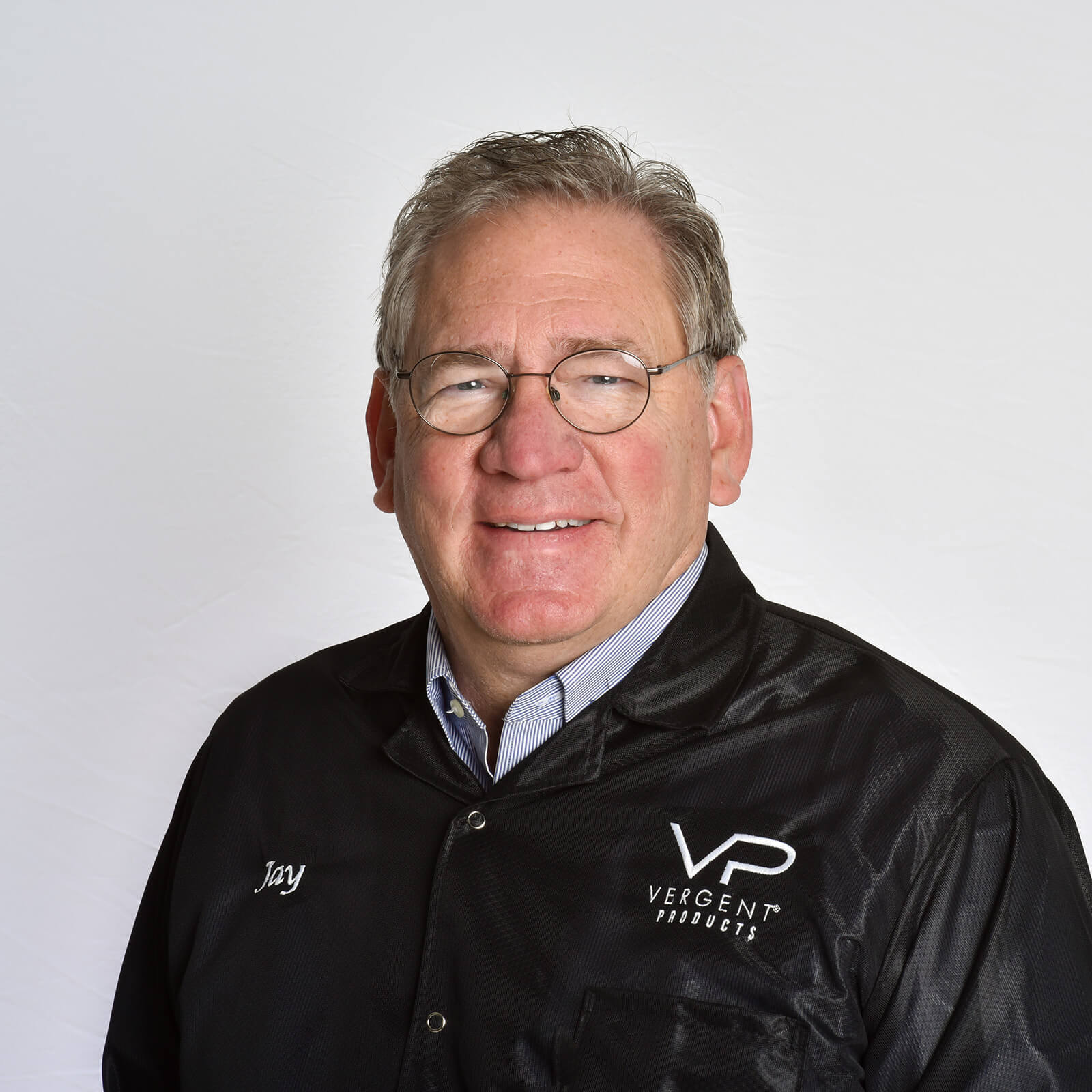 Portrait of Jay, a Vergent Products team member in black